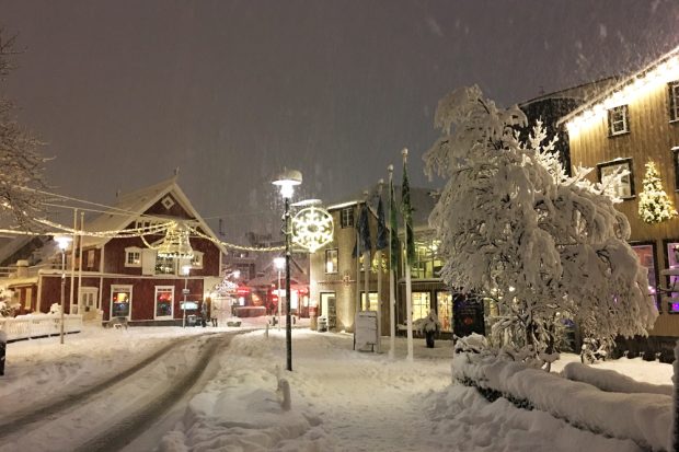Snowy city street in the night